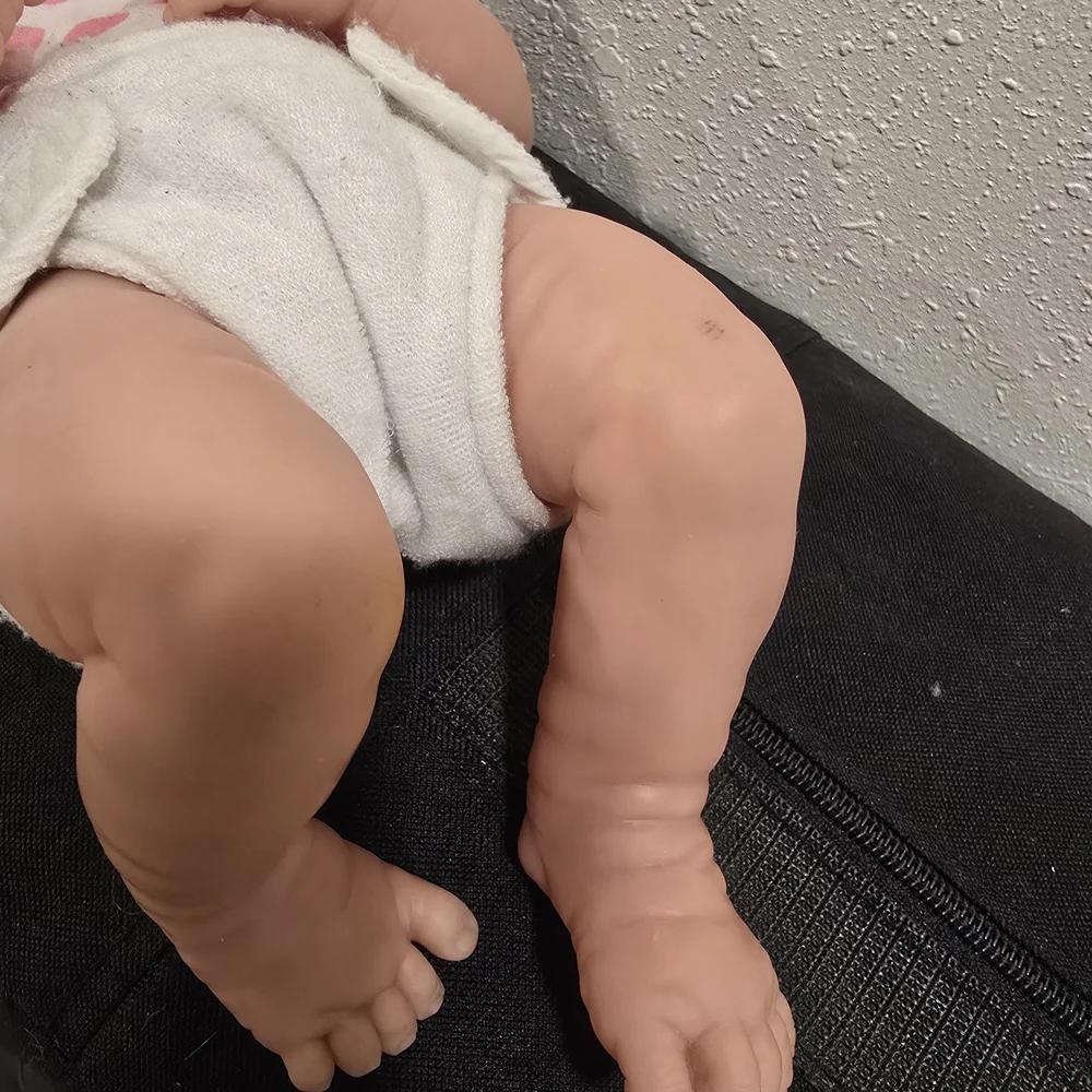 Adorable Baby Doll with Pink Polka Dot Outfit